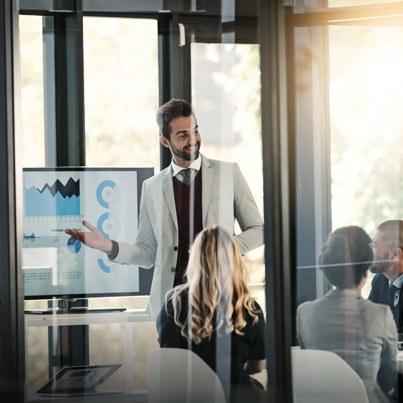 ASAP_a male admin goes over wage trends in a meeting